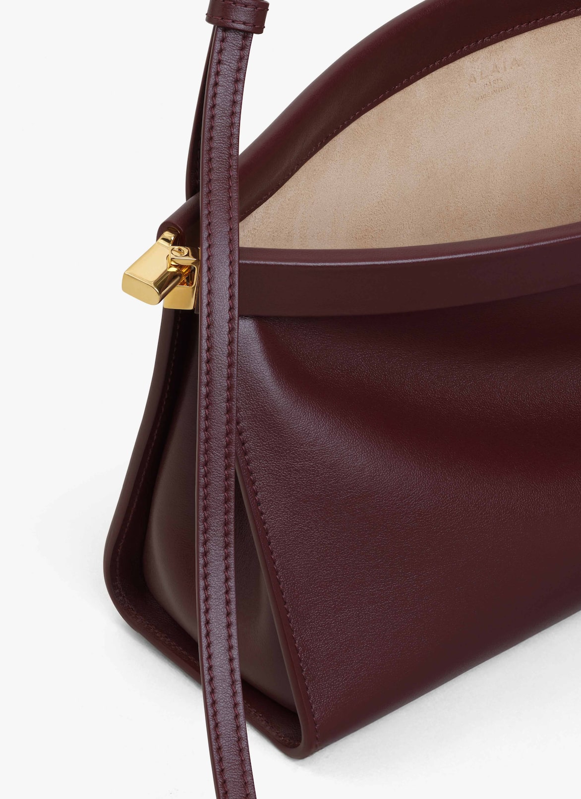 LE CLICK EAST WEST MEDIUM BAG IN LEATHER ALAÏA GARNET RED LE CLICK EAST WEST MEDIUM BAG IN LEATHER